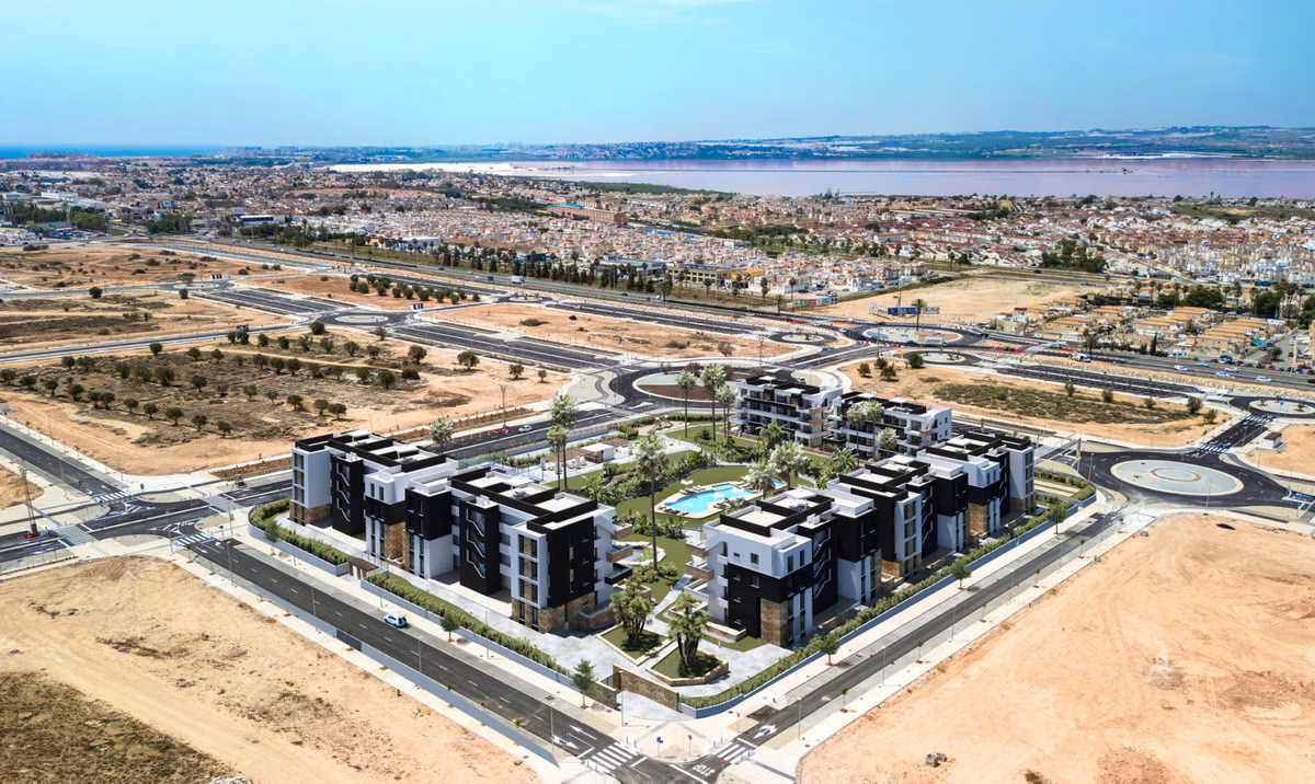 Drone view of La Hoya with the salt lagoon on the horizon