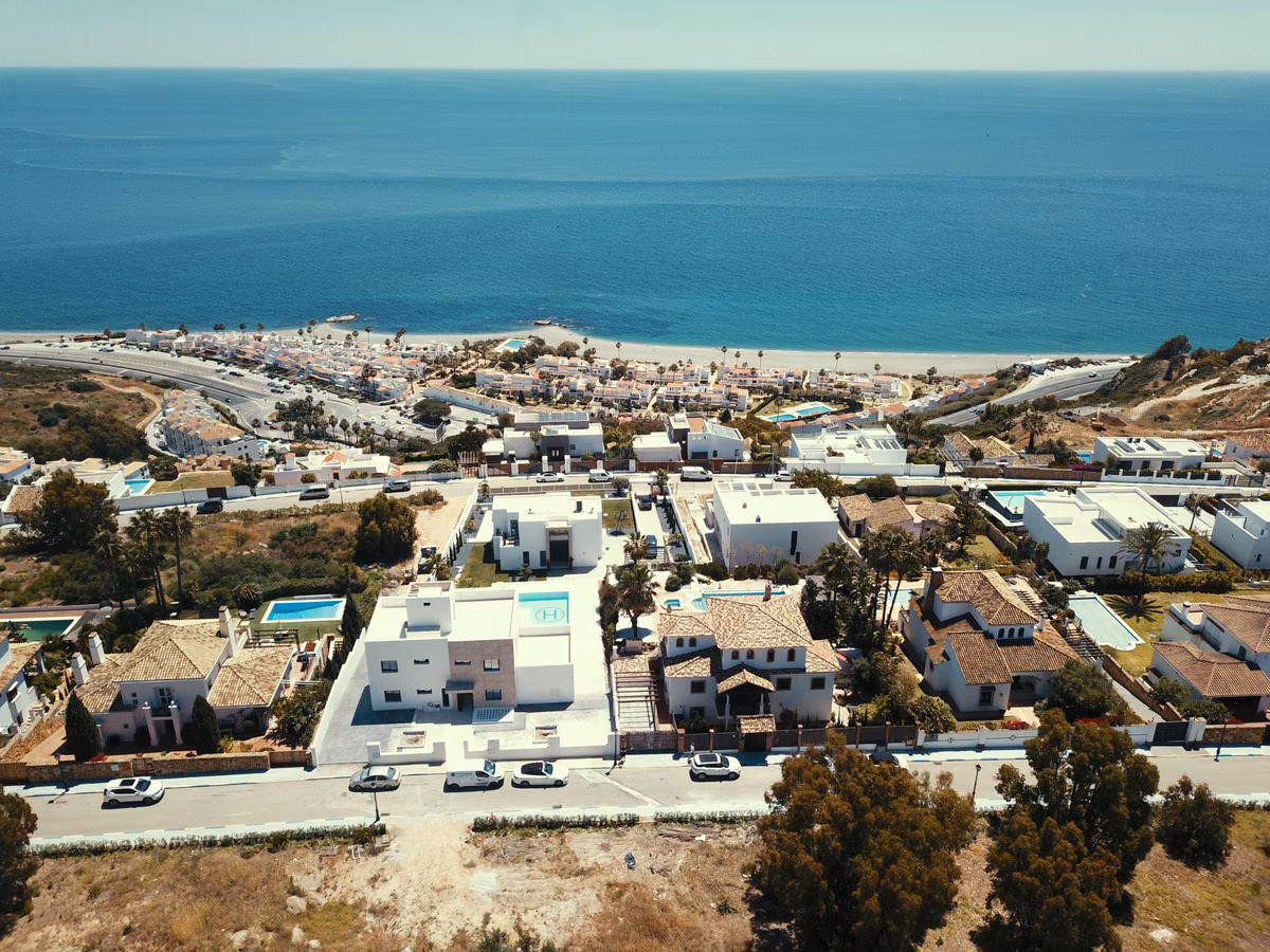Aerial view over the La Paloma villas towards the sea, Manilva