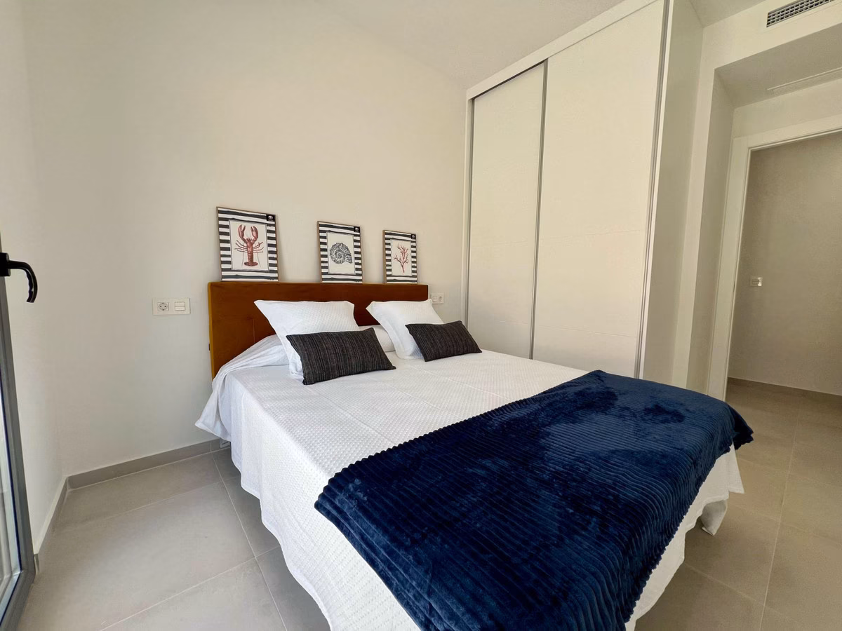 Bedroom with double bed and built-in wardrobe