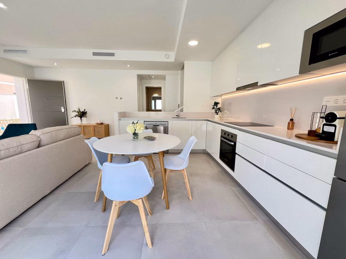 Open kitchen and dining area with round table