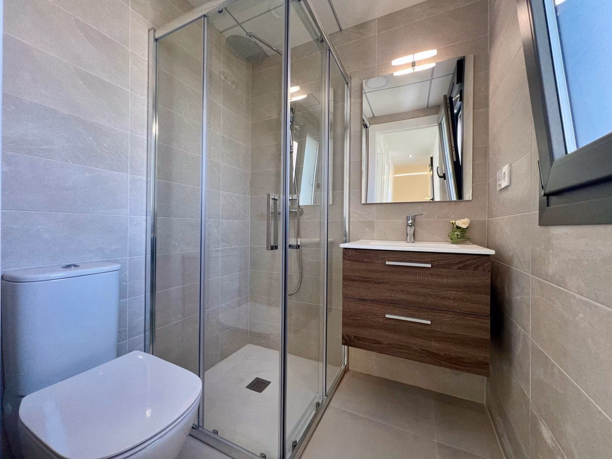 Shower room with glass screen and toilet