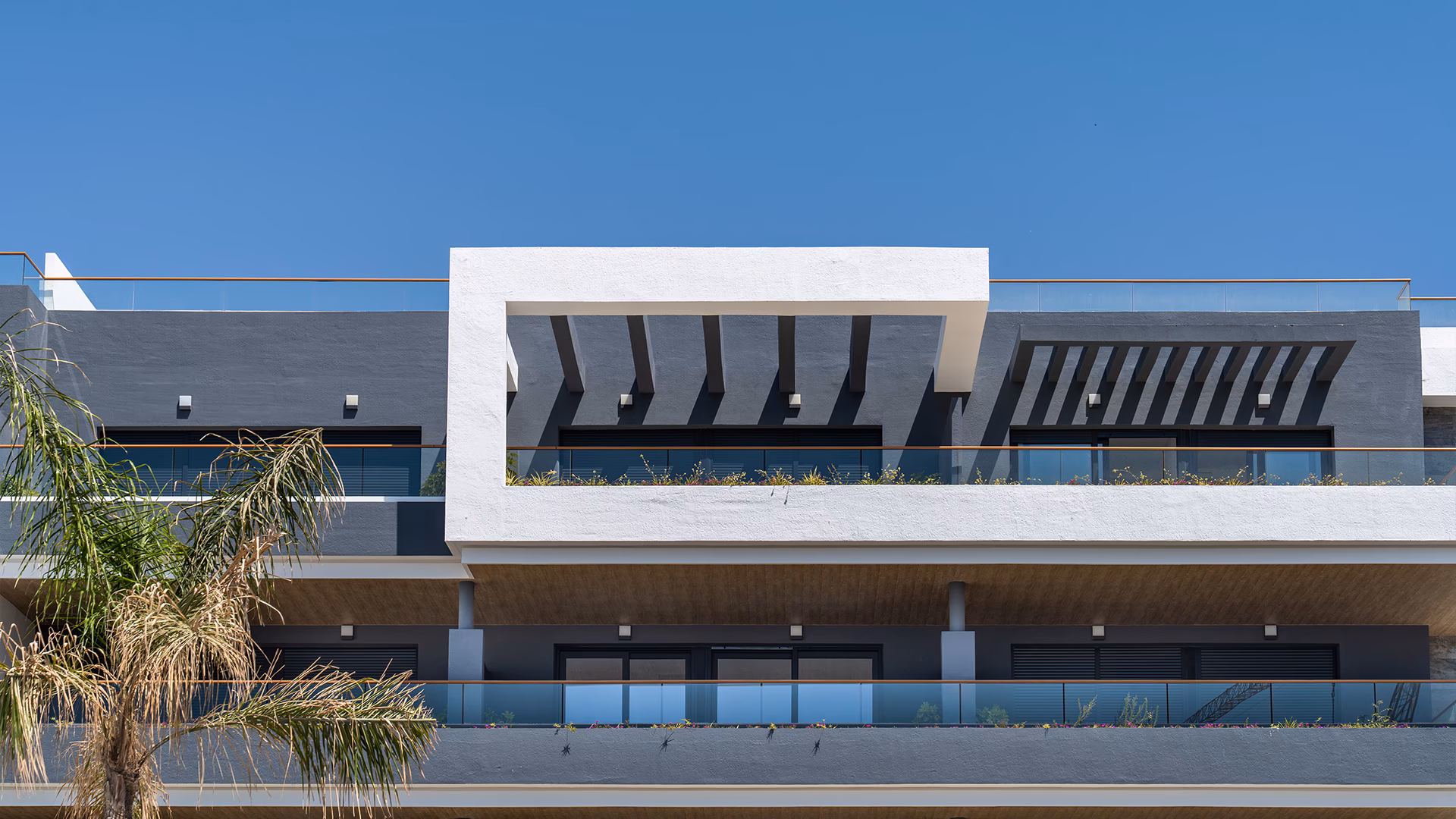 Rooftop terrace with pergola and loungers