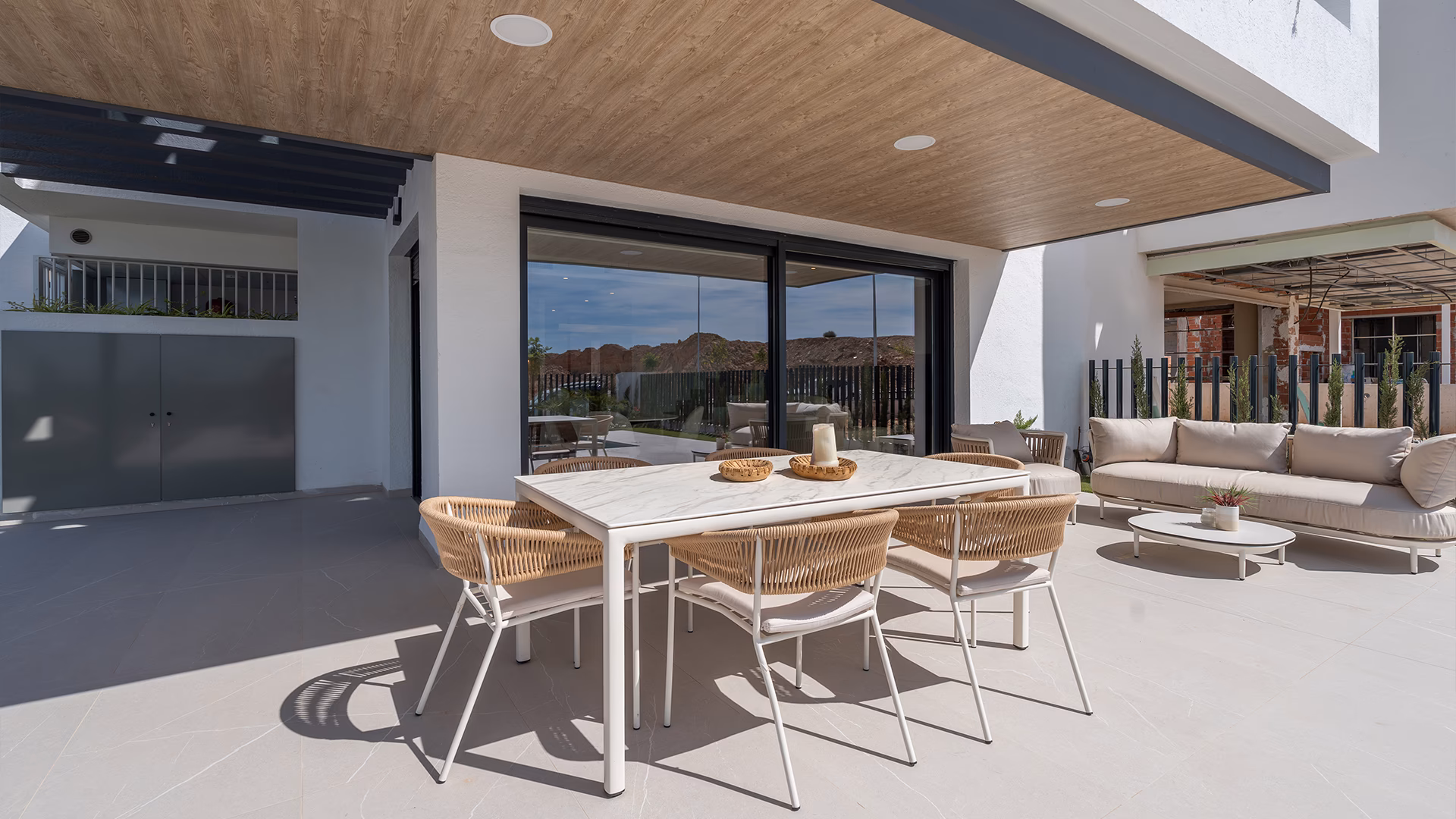 Terrace dining under a pergola