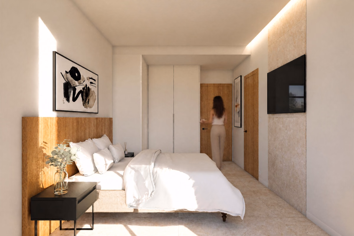 Bedroom with wall TV and hallway, Lakeview Bungalows