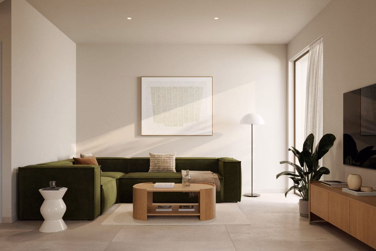 Wohnzimmer mit grünem Sofa in einem Haus von Larcosta Homes II, Algorfa