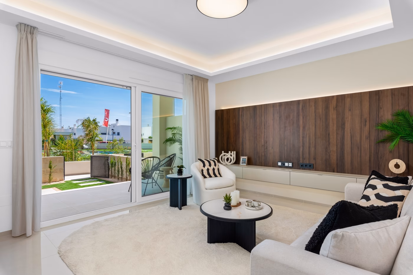 Appartement témoin : séjour avec baie coulissante sur la terrasse