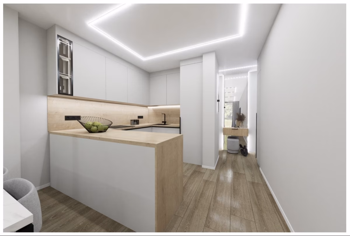Küche mit weißen Fronten und Halbinsel in einer Wohnung von Maximlux