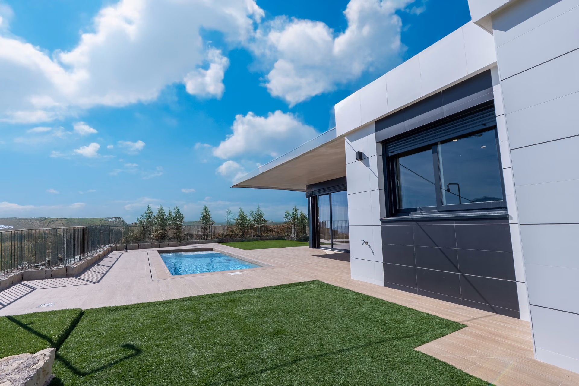 Pool terrace of the show villa with the valley beyond