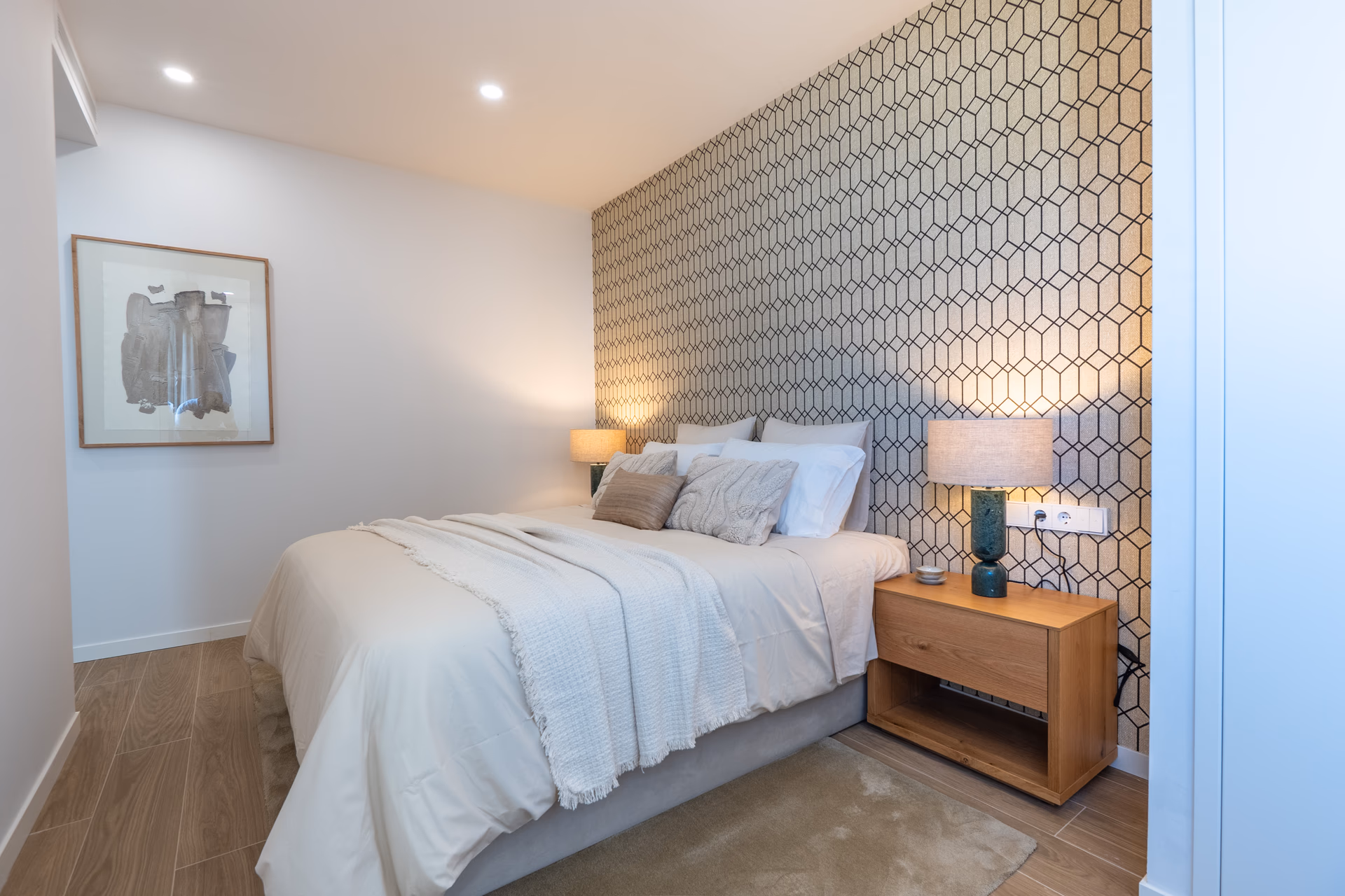 Master bedroom of the show villa with bedside lamps