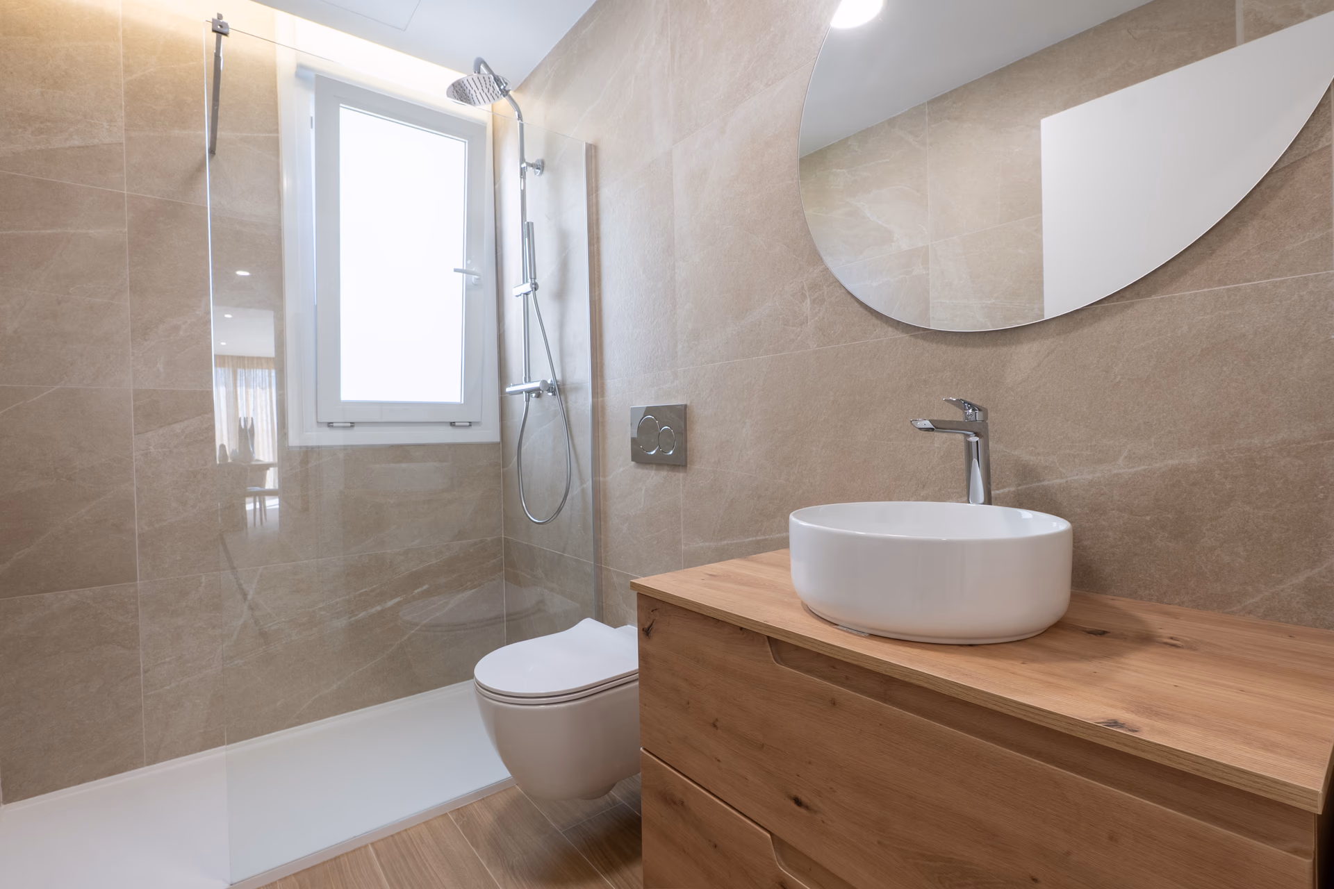Bathroom with marble-effect tiles, wooden vanity and shower
