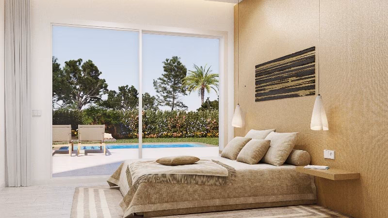 Dormitorio con ventanal corredero a la terraza de la piscina