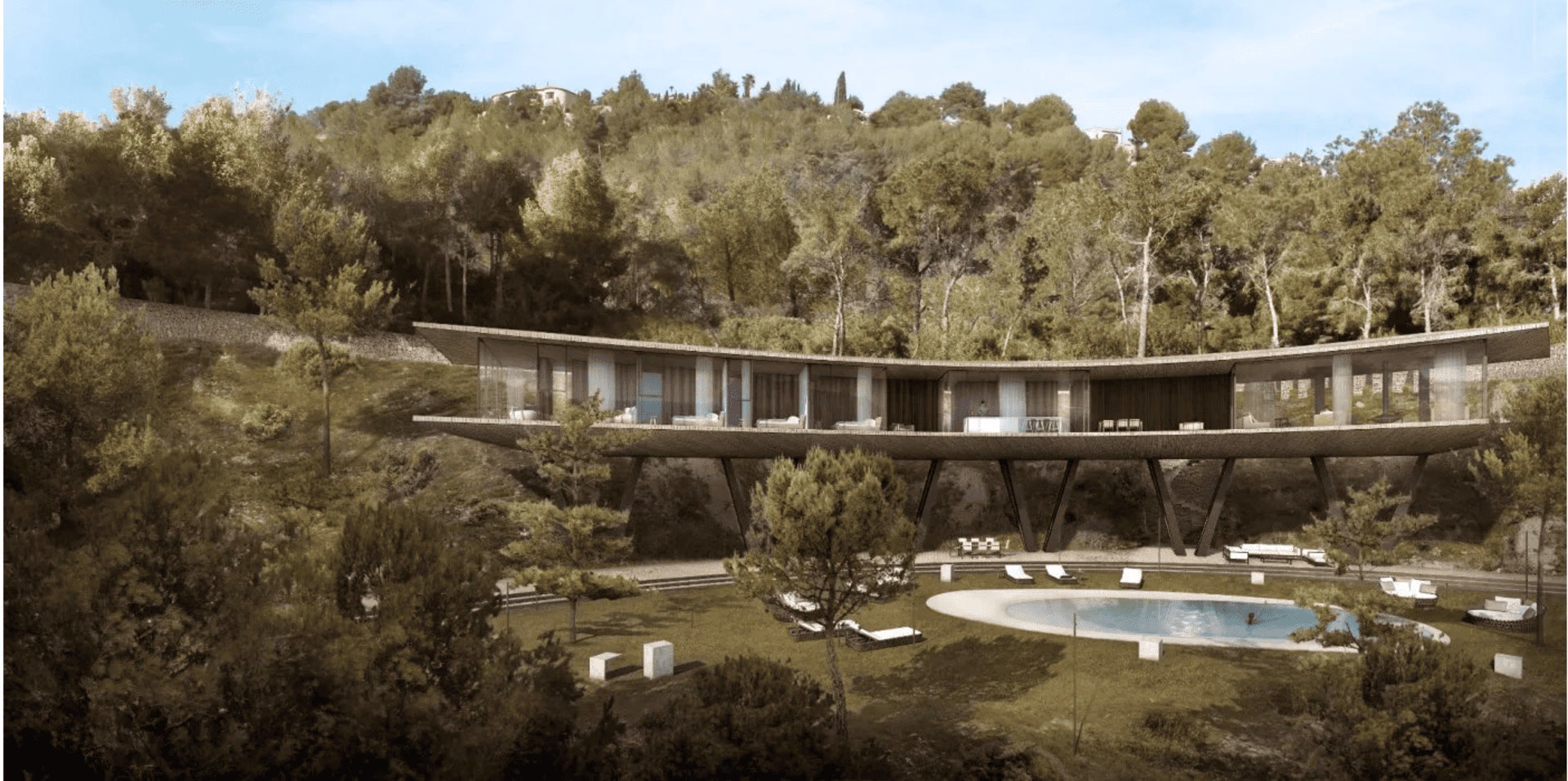 La villa vista desde el jardín, con la larga planta de día acristalada