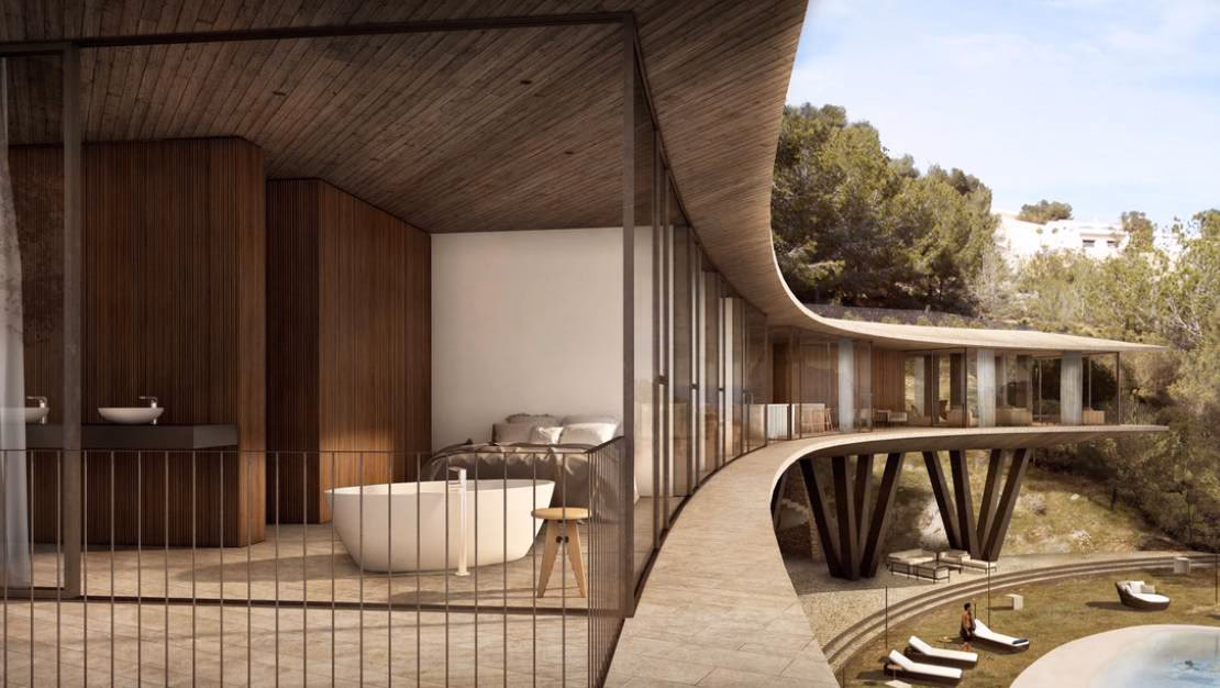 Dormitorio con bañera exenta, paredes de madera y la terraza curva al otro lado del cristal