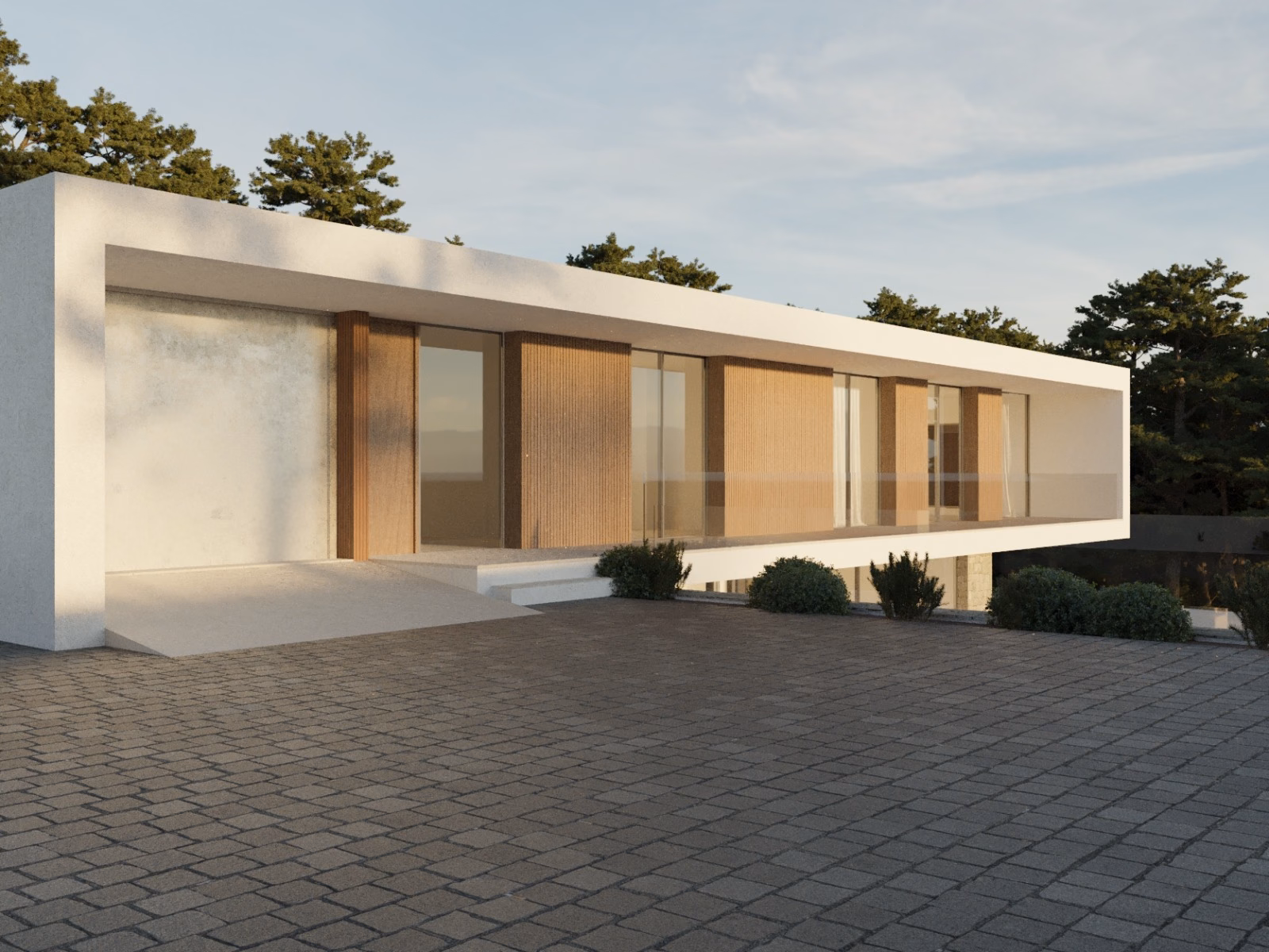 Front of the villa with a timber entrance door and a paved drive