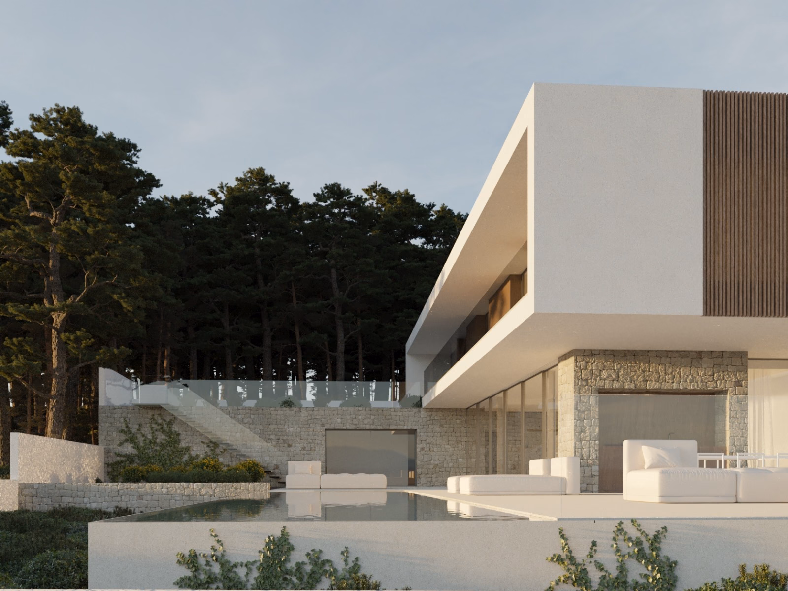 Villa across the pool, with the stone-clad ground floor and terraces