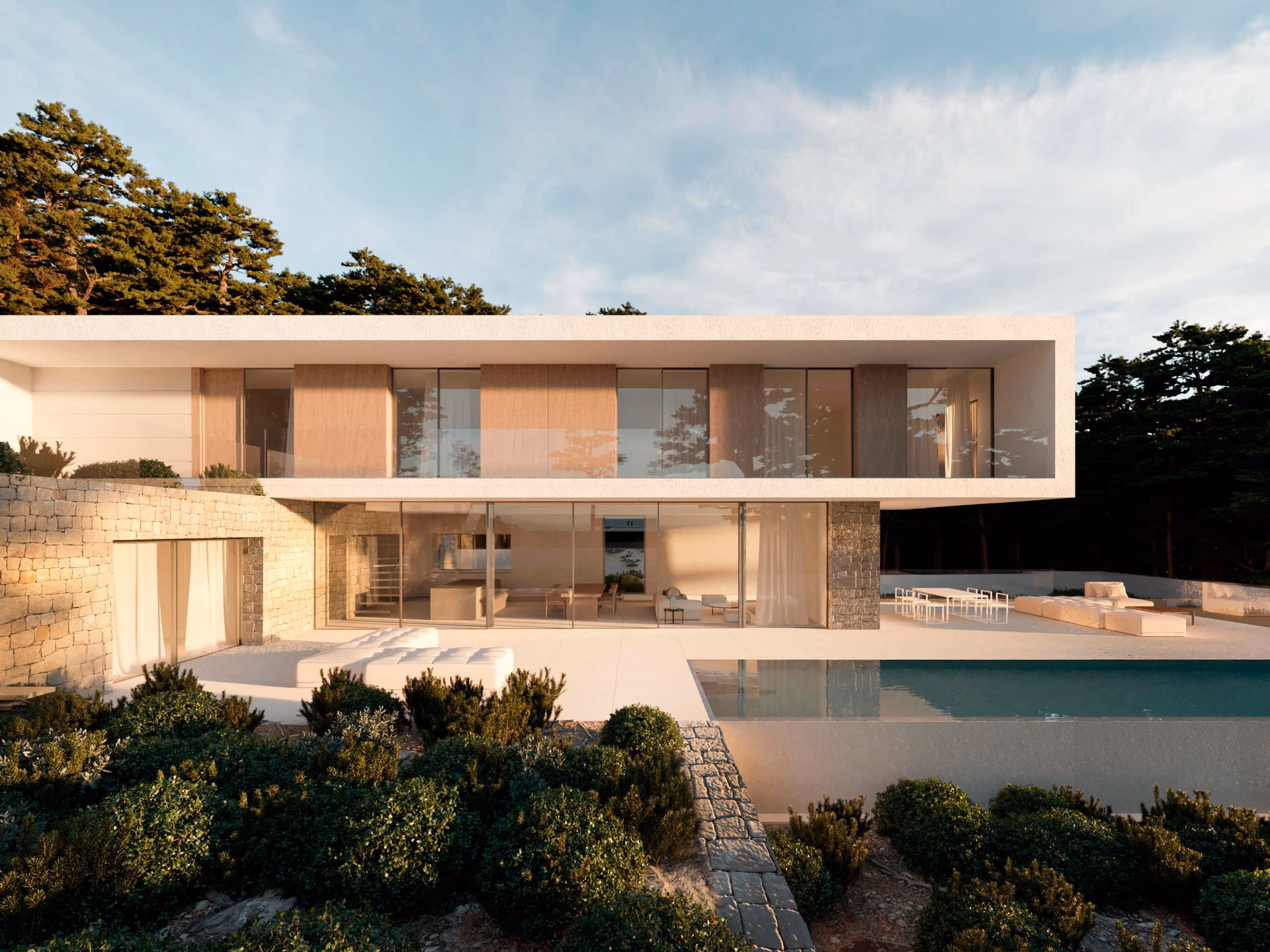 Front elevation of the villa with the pool and Mediterranean planting