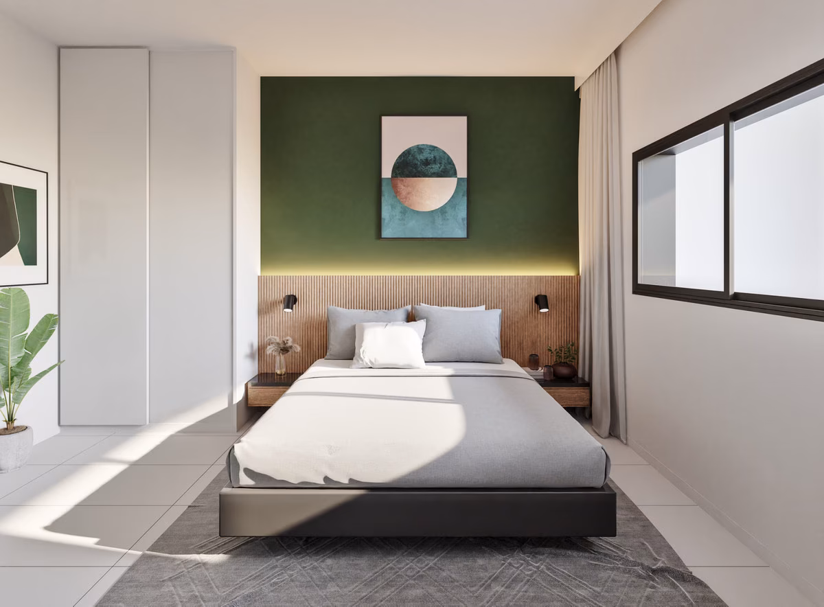 Hauptschlafzimmer mit Doppelbett und grüner Akzentwand