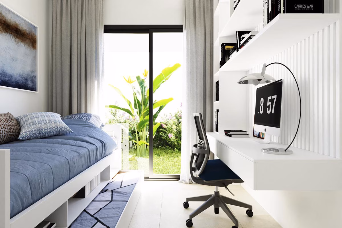 Dormitorio-estudio con diván y escritorio con salida al jardín en Nature Views