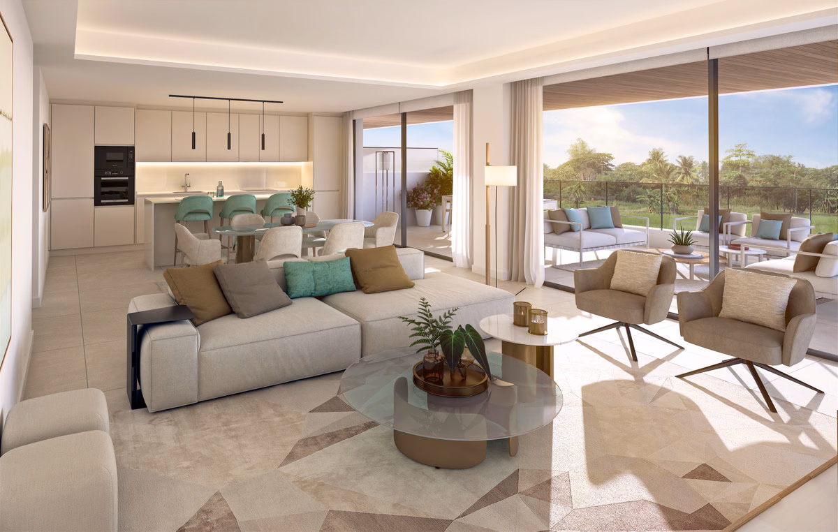 Salón de concepto abierto con cocina en un apartamento de Naya Residences