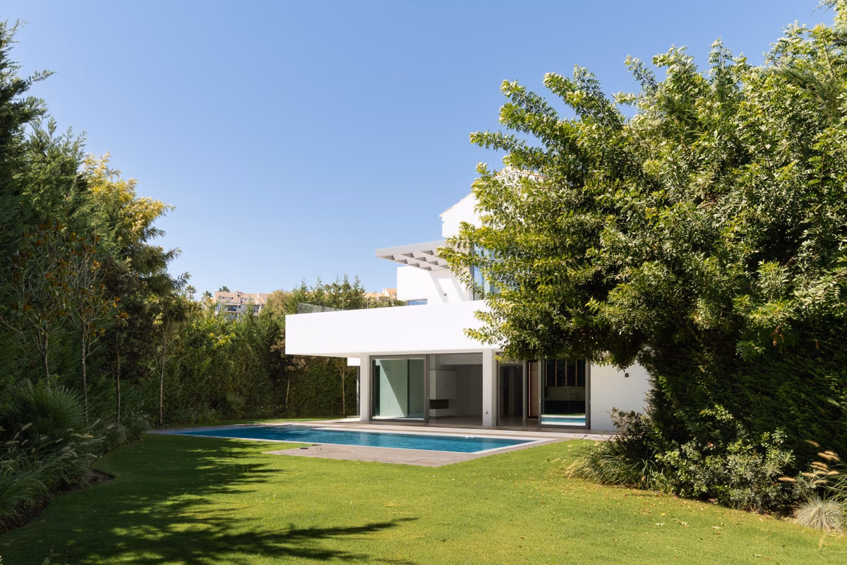 Garden lawn with pool and mature trees
