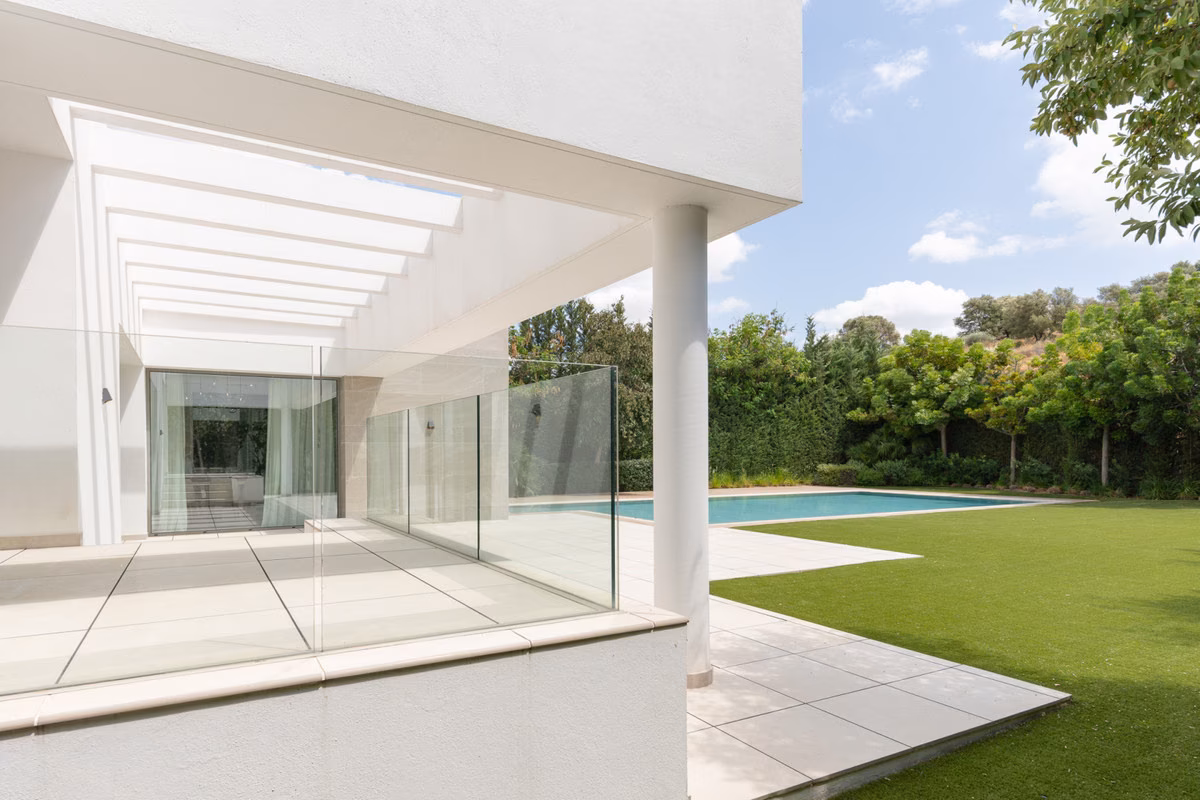 Covered porch opening onto the garden and pool