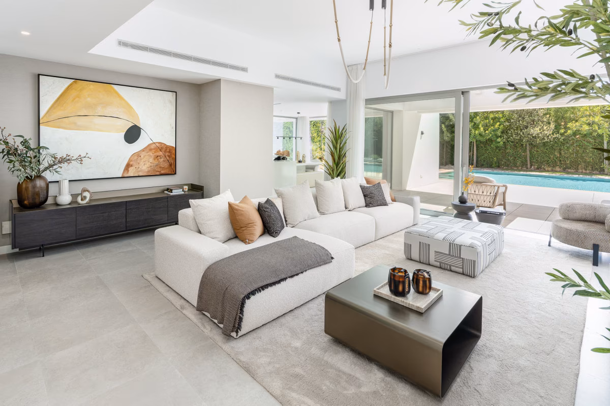Living room with sliding glass doors to the pool