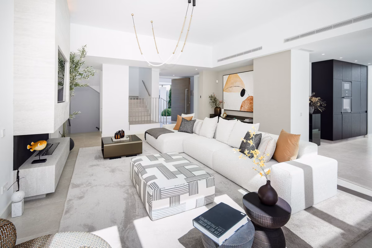 Lounge with fireplace and staircase