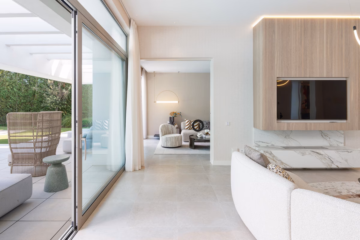 Living room opening to the covered terrace