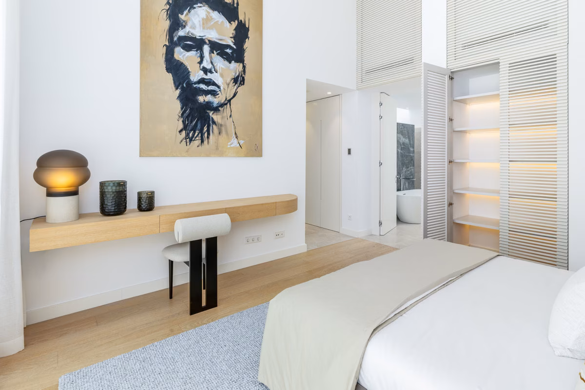 Bedroom with desk and built-in wardrobe