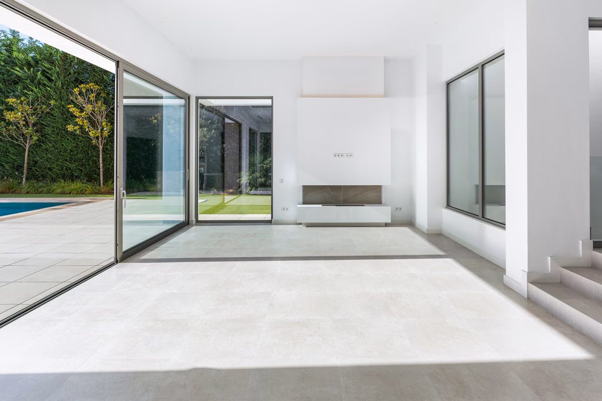 Unfurnished glazed room opening to the garden