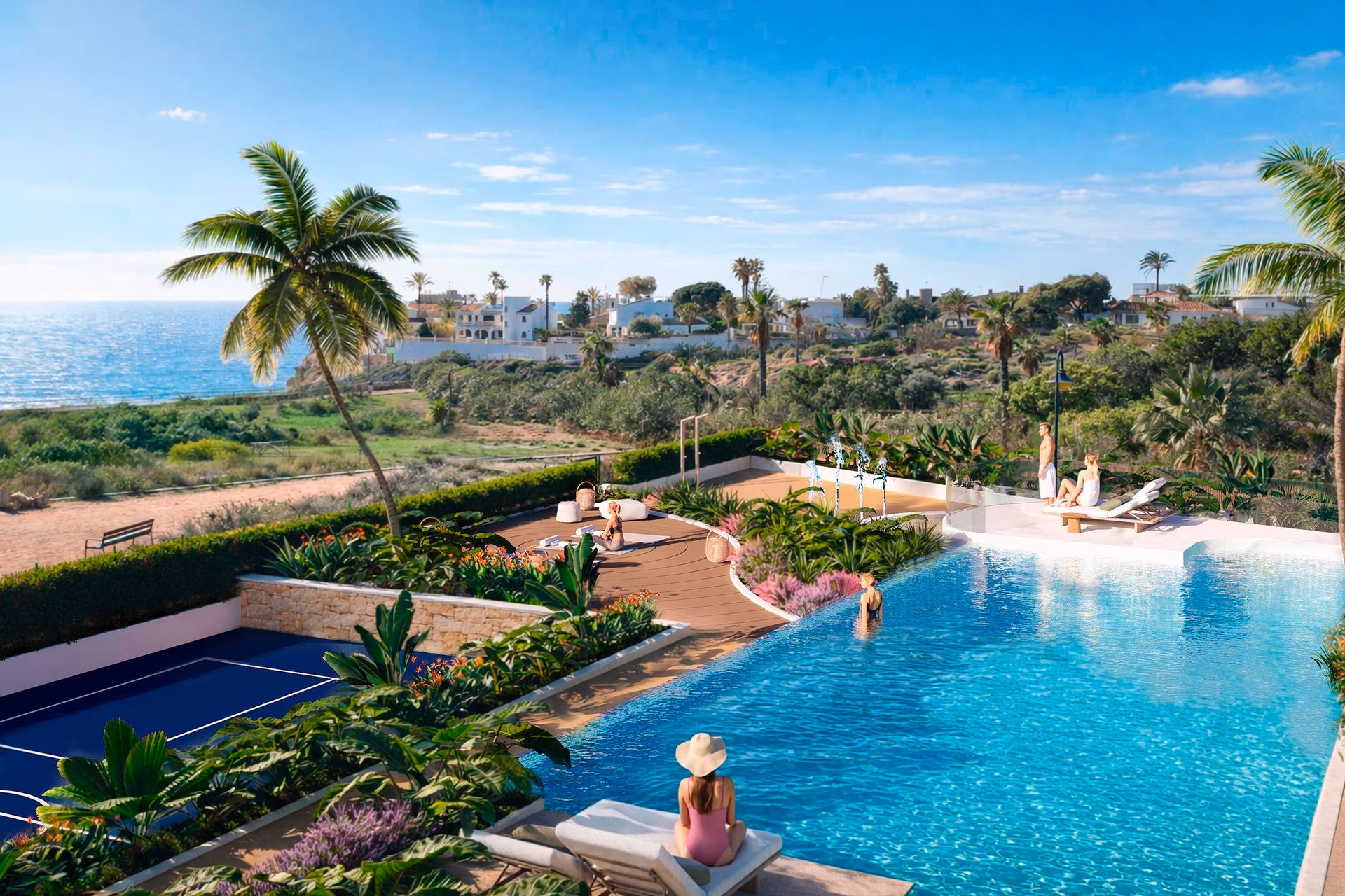 Infinity pool and sun loungers facing the sea at NJOY SHORE