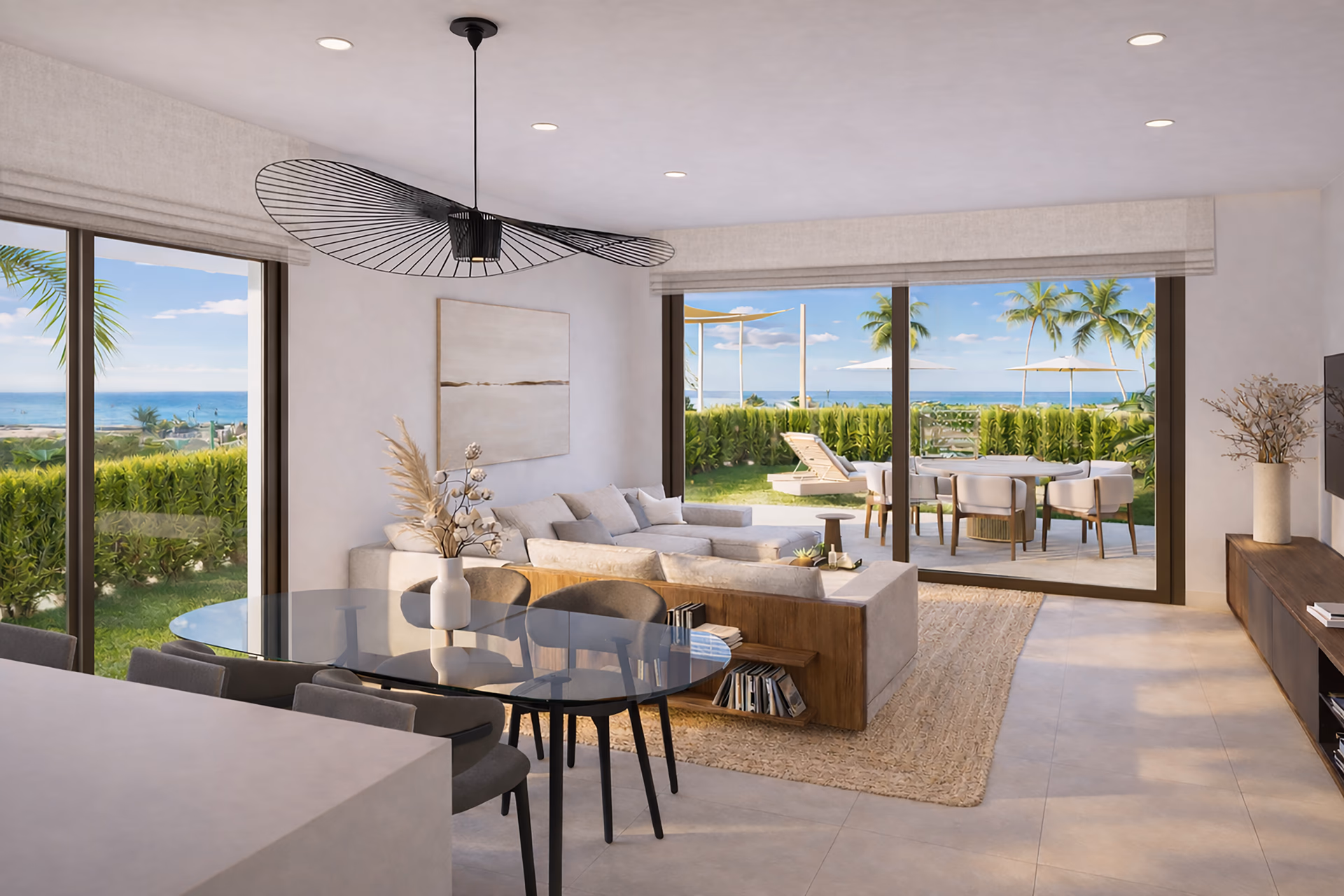 Open-plan living and dining space opening to a sea-view terrace at NJOY SHORE