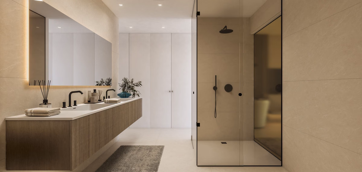 Bathroom with a long vanity, black taps and a walk-in shower