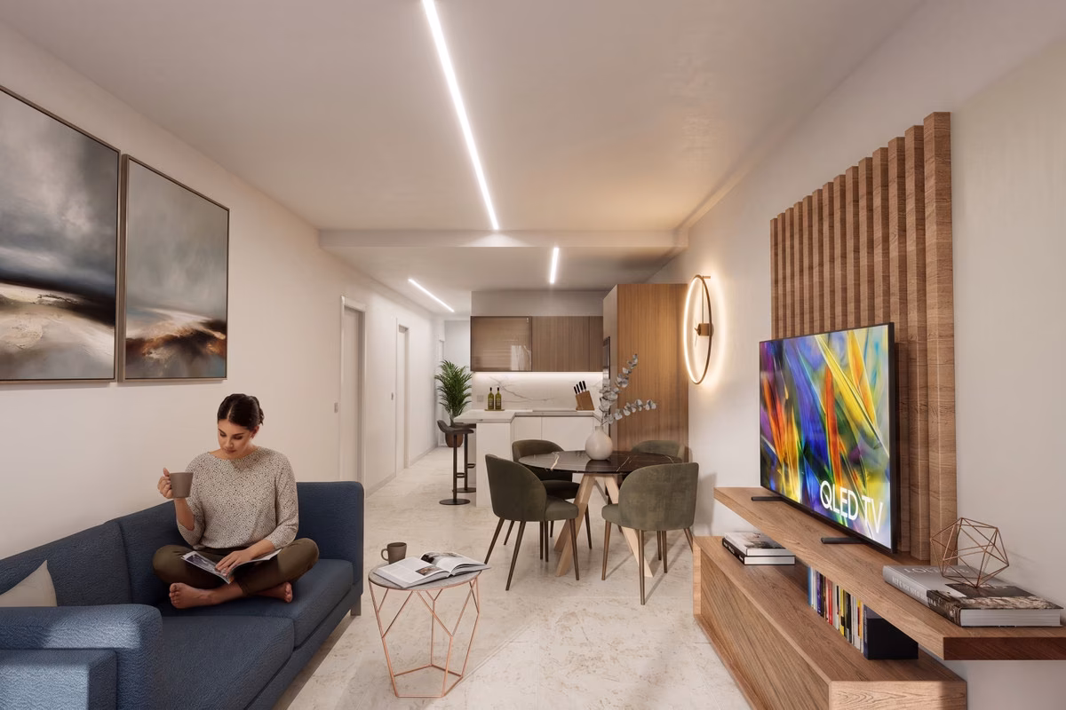 Living room with a wood-slatted TV wall and the kitchen beyond