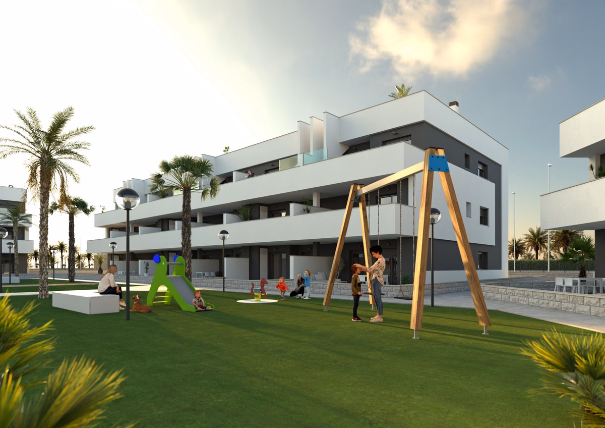 Spielplatz und Gärten zwischen den weißen Blöcken, Oasis Laguna 2 Guardamar