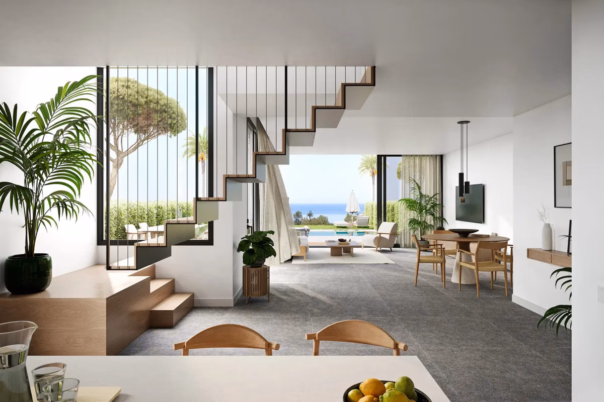 Open-plan living and dining area with staircase at Pine Valley Villas
