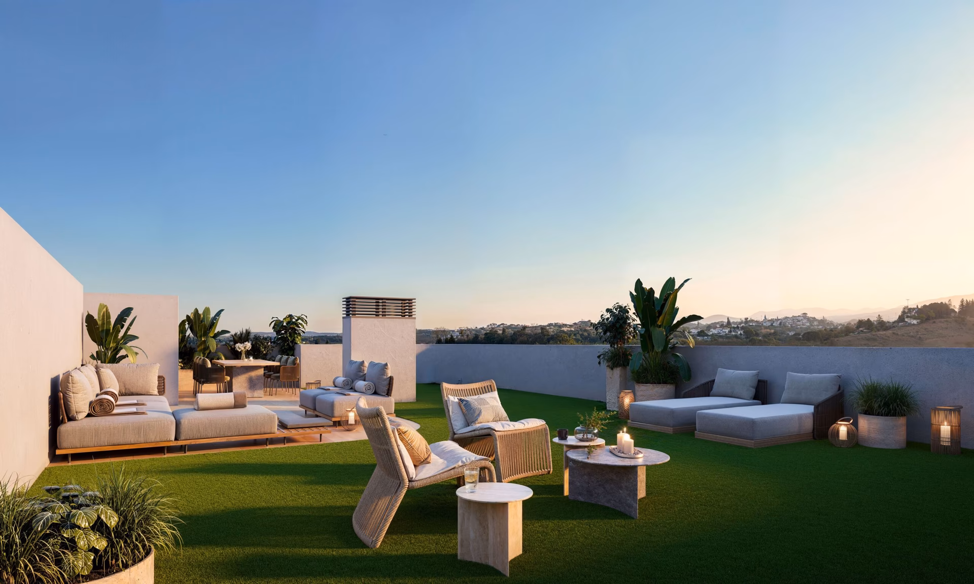 Solarium du penthouse avec mobilier lounge et vue sur la côte