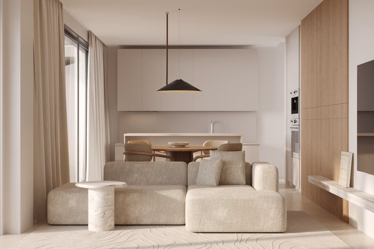 Cocina abierta detrás del sofá del salón