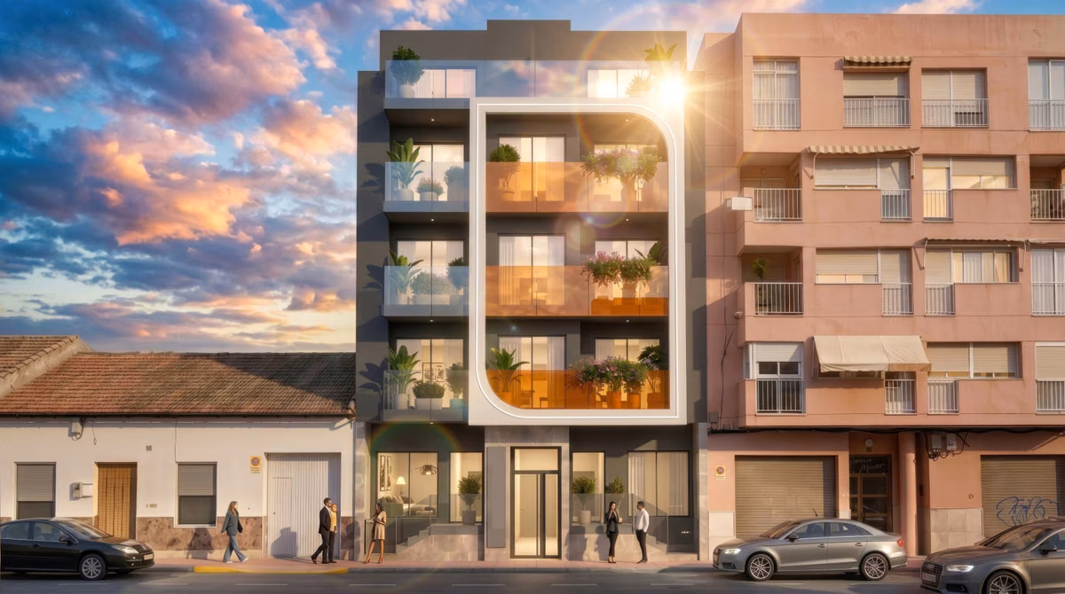 Five-storey façade with curved orange balconies between neighbouring buildings in central Guardamar
