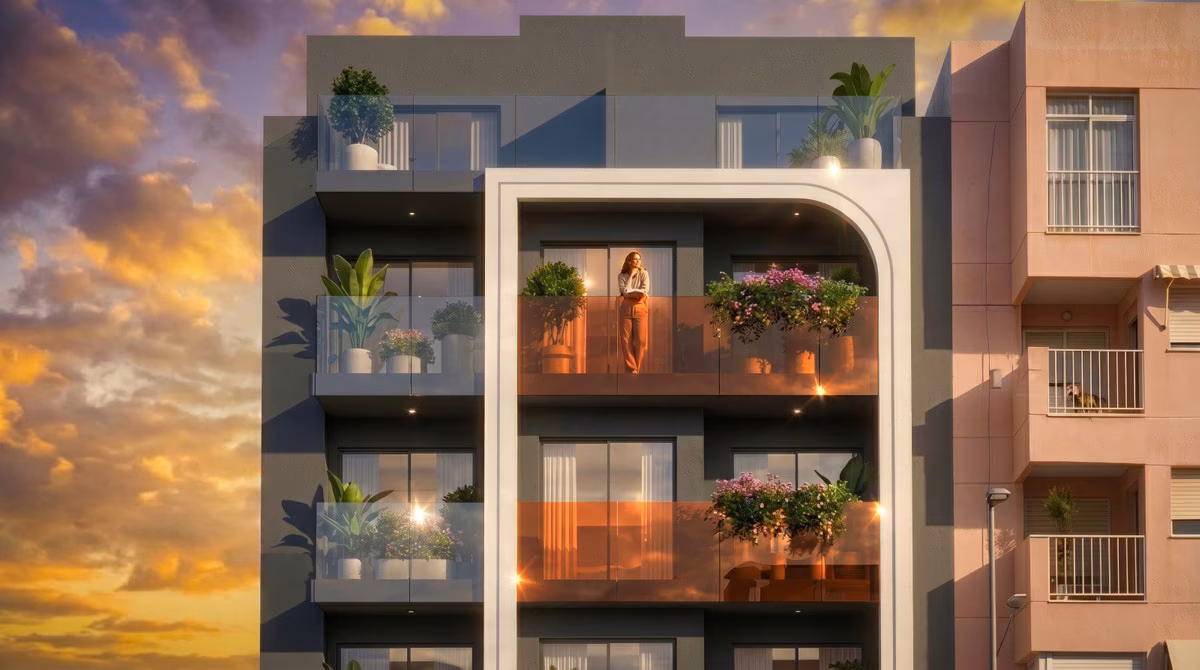 Upper floors of the façade with balconies and planters at dusk