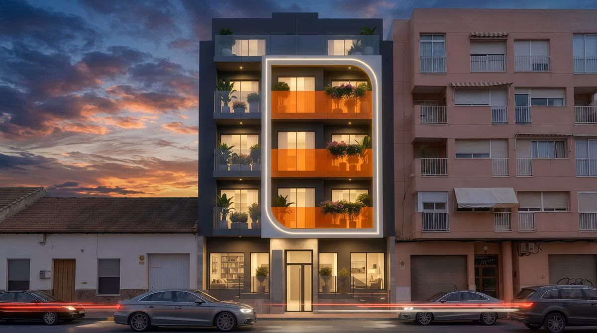Façade of Residencial Alegria at sunset with lit orange-framed balconies, Guardamar del Segura