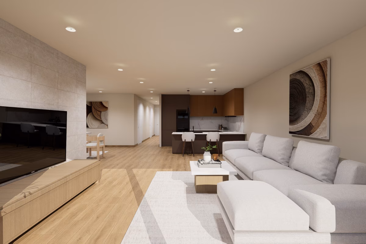 Living room with sofa and TV unit, kitchen behind, in a Residencial Aura villa