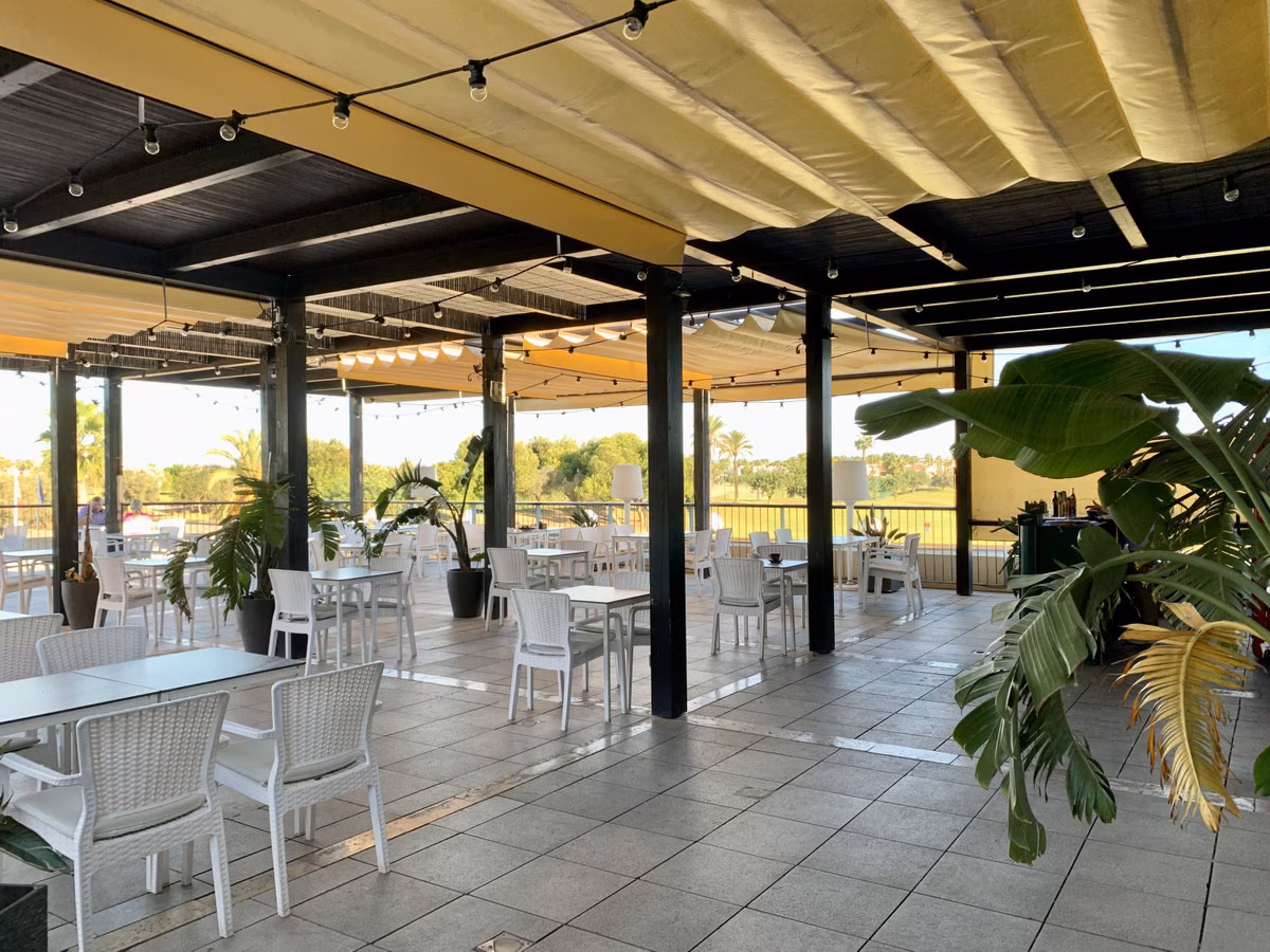 Covered restaurant terrace at the resort clubhouse
