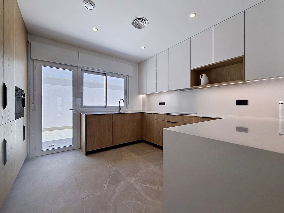 Kitchen with glazed doors out to the courtyard