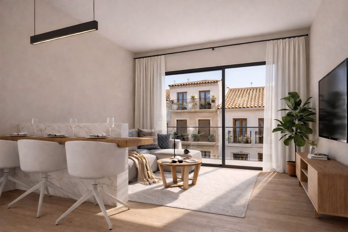 Living room with dining bar and glass door to a balcony over tiled rooftops