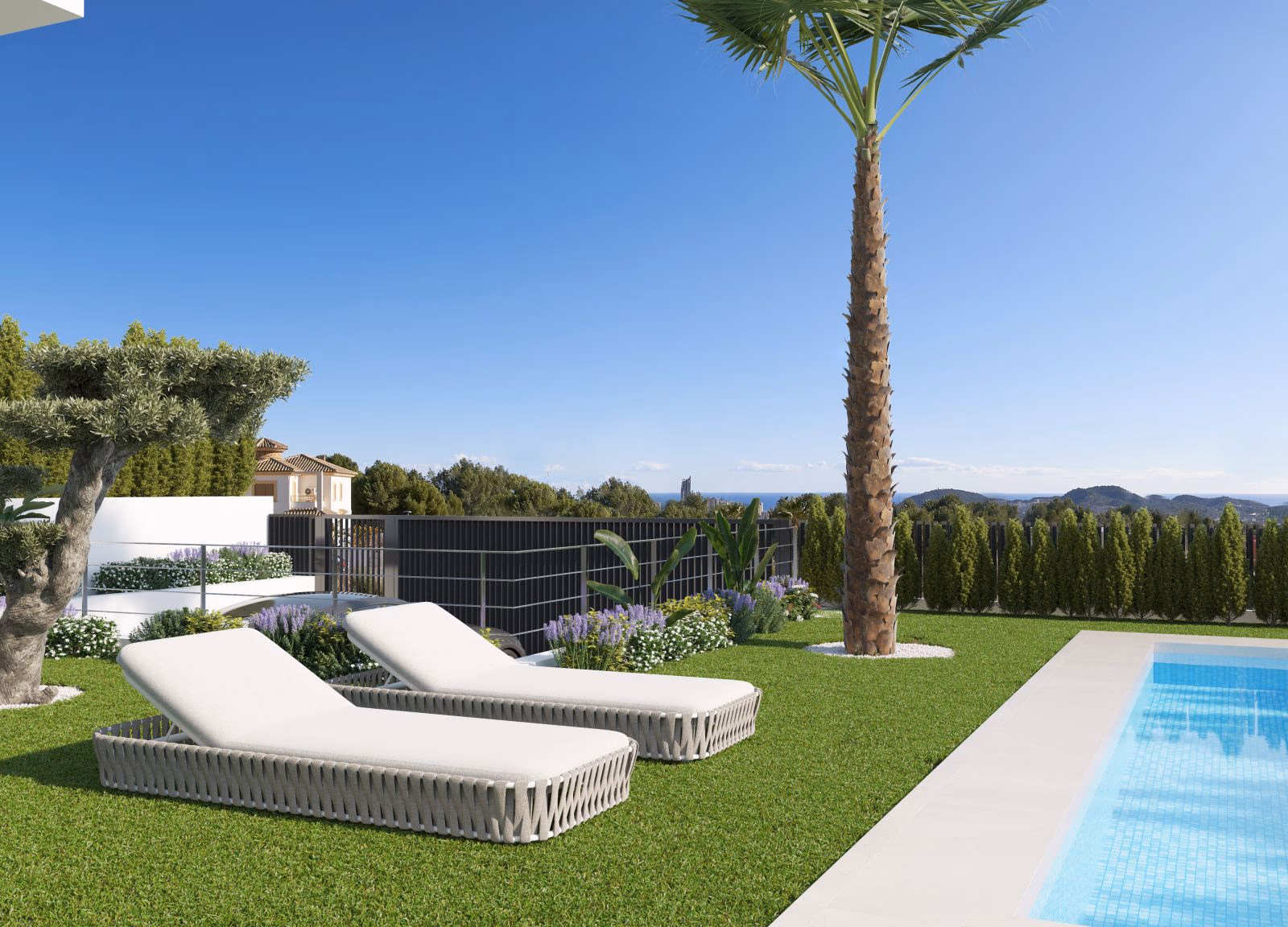Sun loungers on the lawn beside the private pool