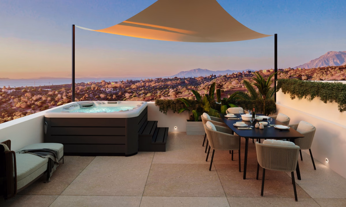 Rooftop solarium with jacuzzi and coast panorama at dusk at Serenity Hills