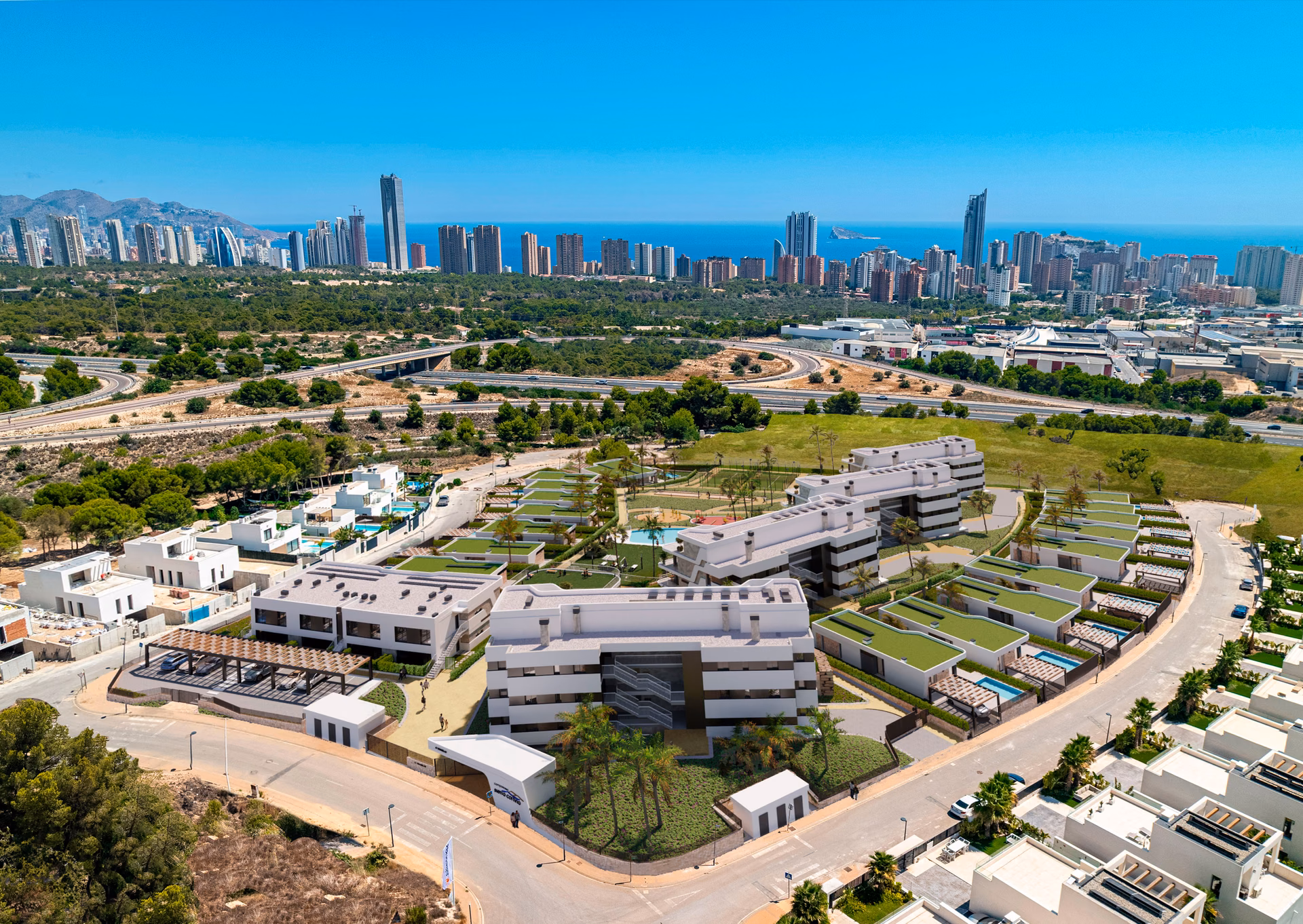 Aerial render: the apartment blocks and villas of Sierra Cortina Residences with Benidorm behind
