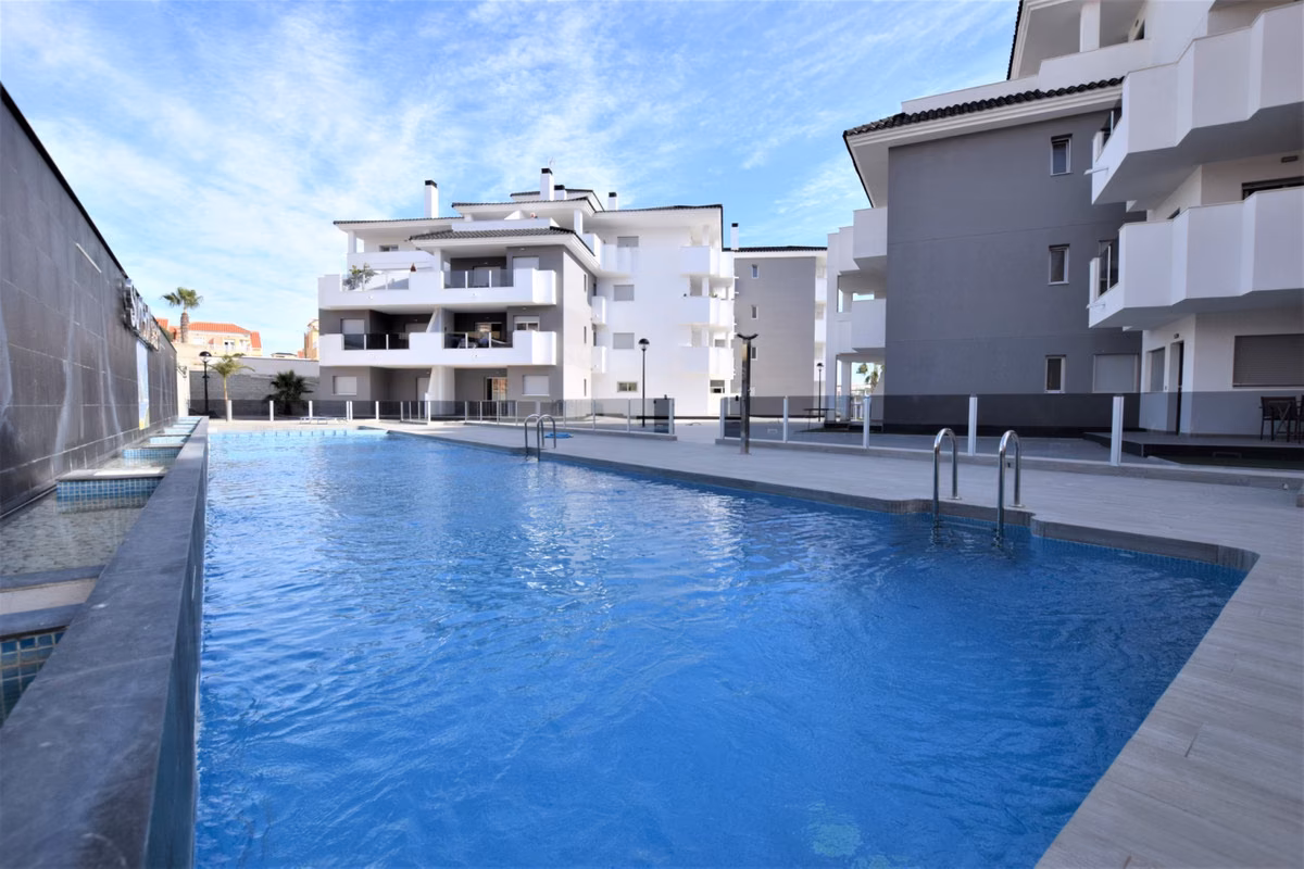 Communal pool with the apartment buildings behind, Villamartín