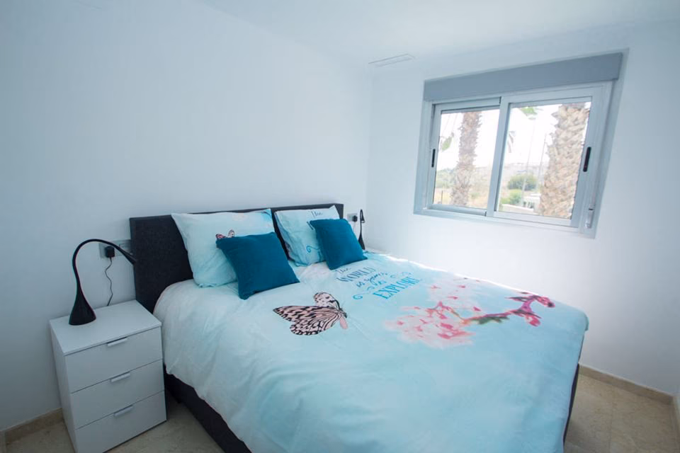 Double bedroom with bedside tables and reading lamp